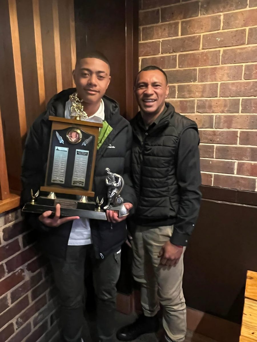 Tevita and son Salesi with trophies 