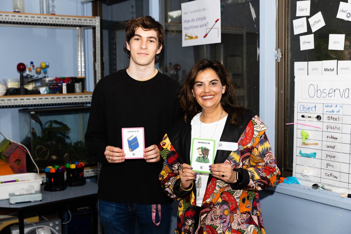 a man and a woman holding up illustrations