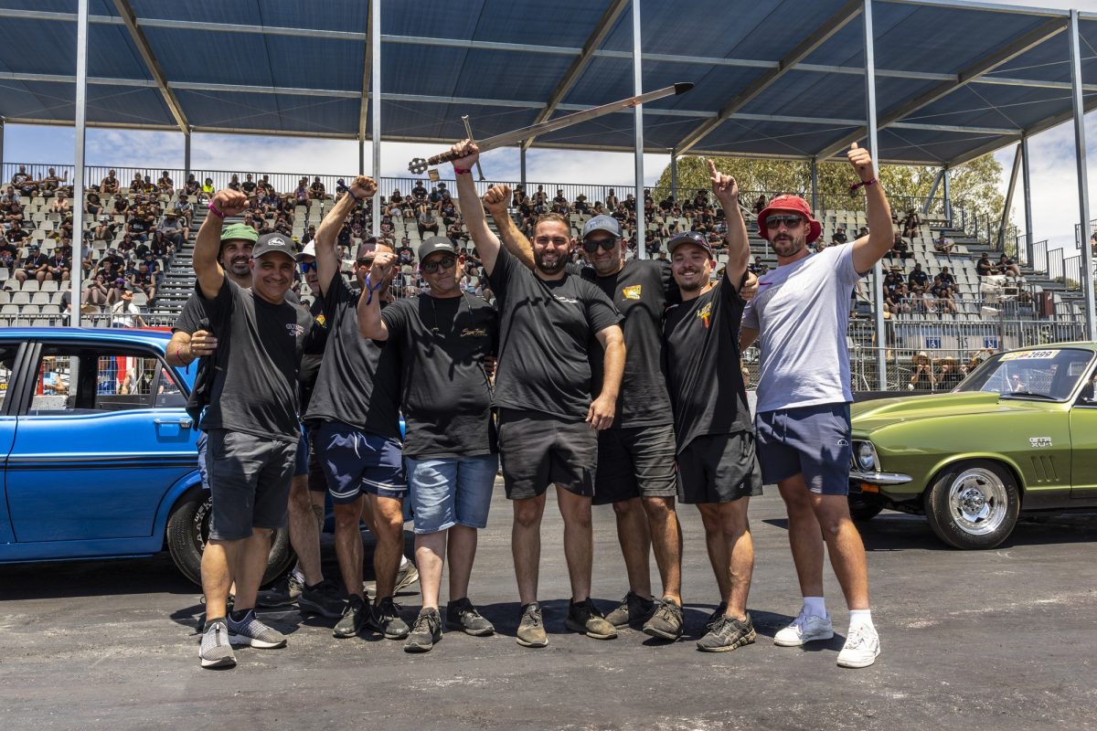 John Fenech proudly holding the Grand Champion's sword at Summernats 37. 