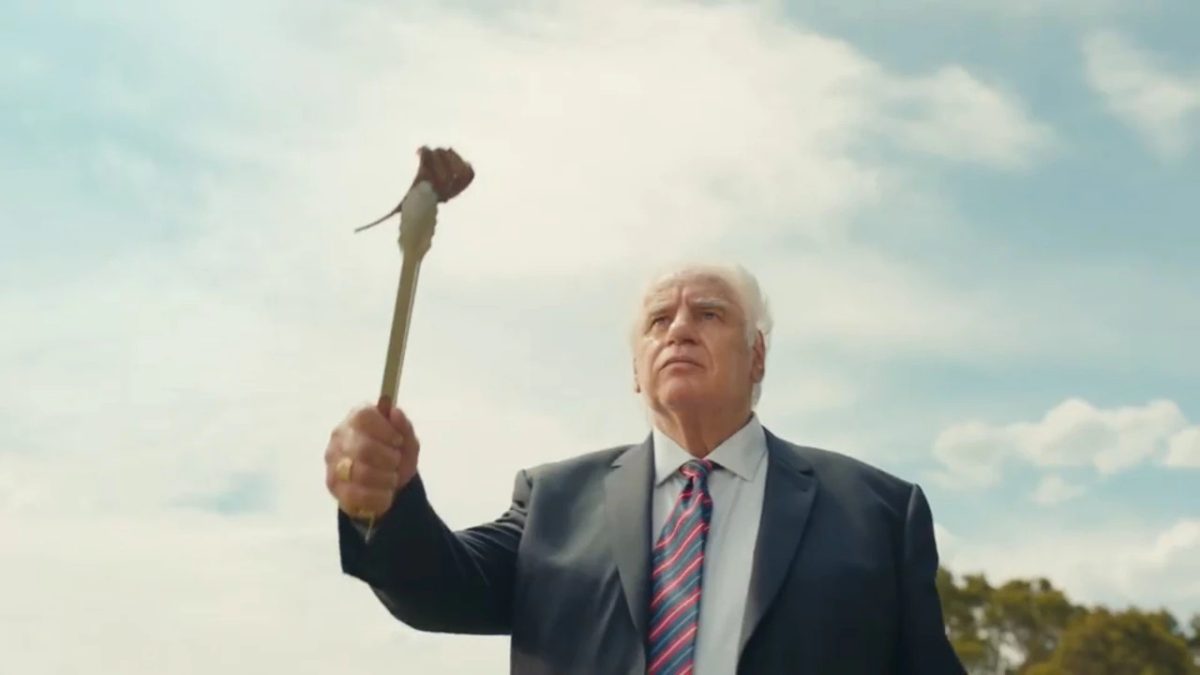 Sam Kekovich holding a lamb chop