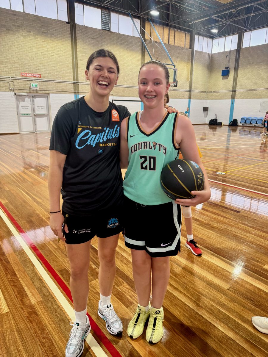 Annabelle Miles (right) who plays for Radford College, with one of her Caps idols, captain Jade Melbourne. 