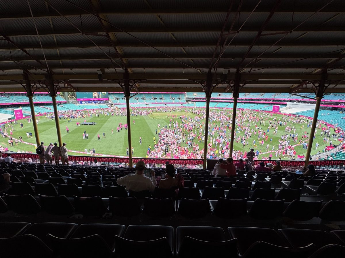 Crowds flood onto the SGC following Australia's win against India