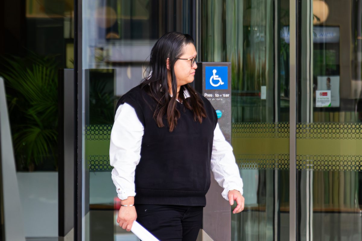 woman leaving court