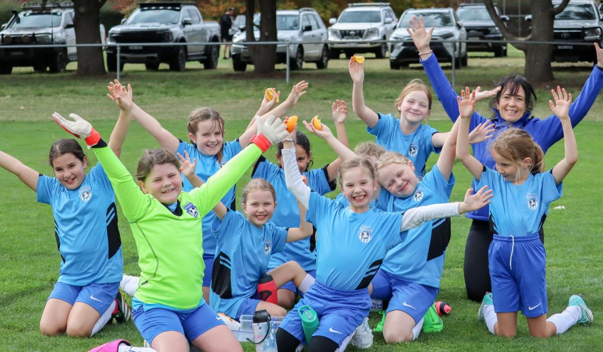 excited kids on soccer field