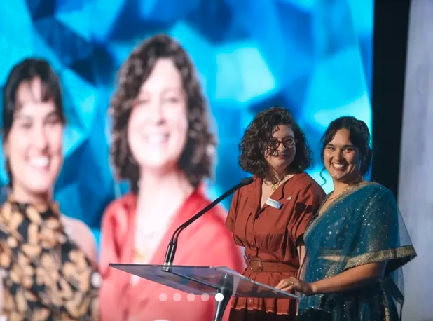 two people receiving awards