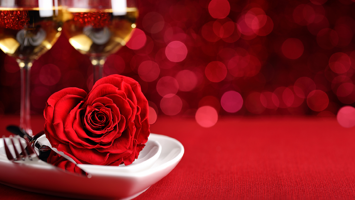 a restaurant's Valentine's Day spread including a red rose and champagne