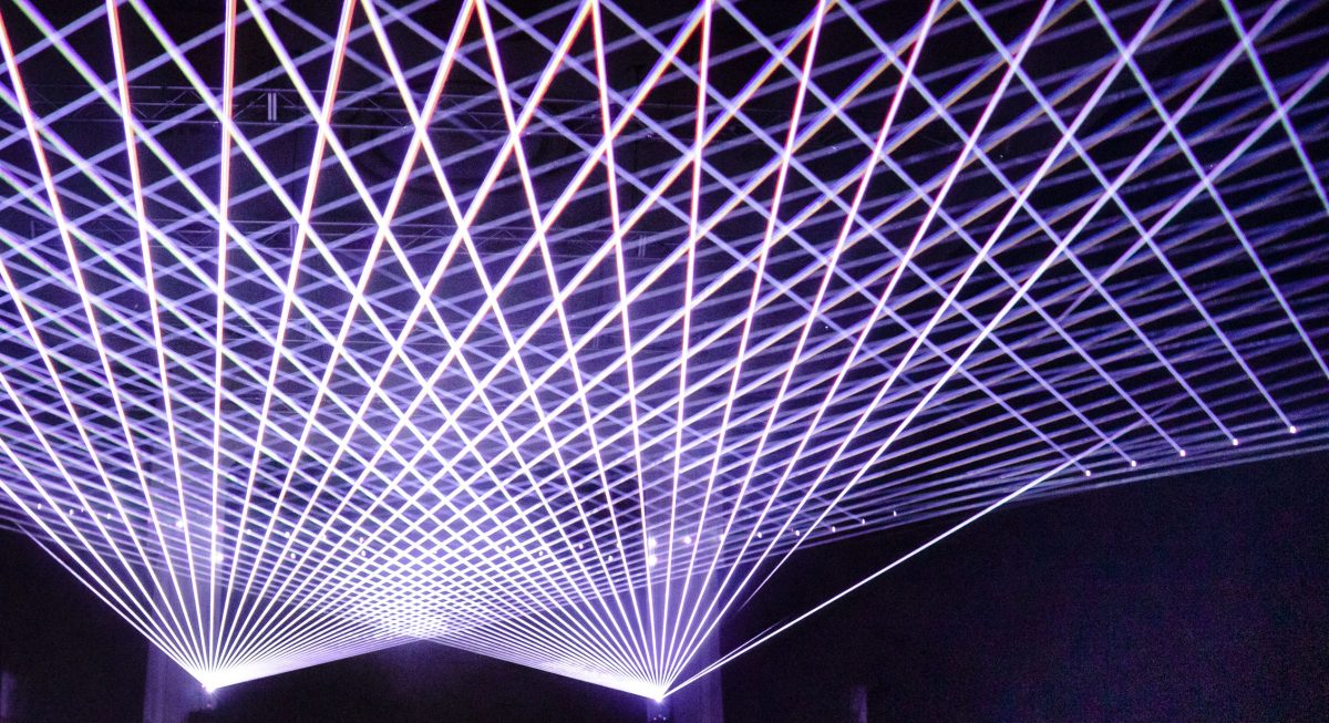 Lasers beam across a ceiling in Constellations by audio visual artist Robin Fox