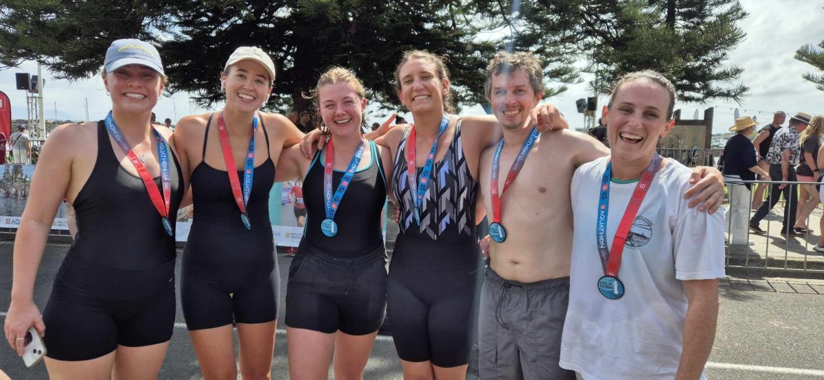 six people smiling after a swim