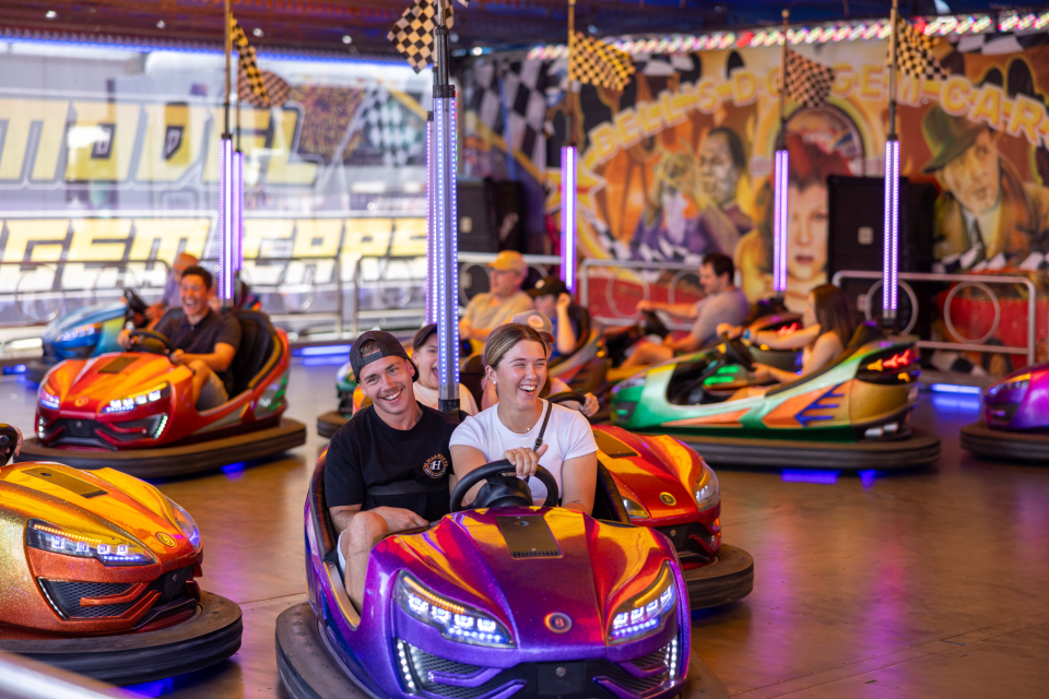 a photo of two people enjoying bumper cars at the canberra royal show