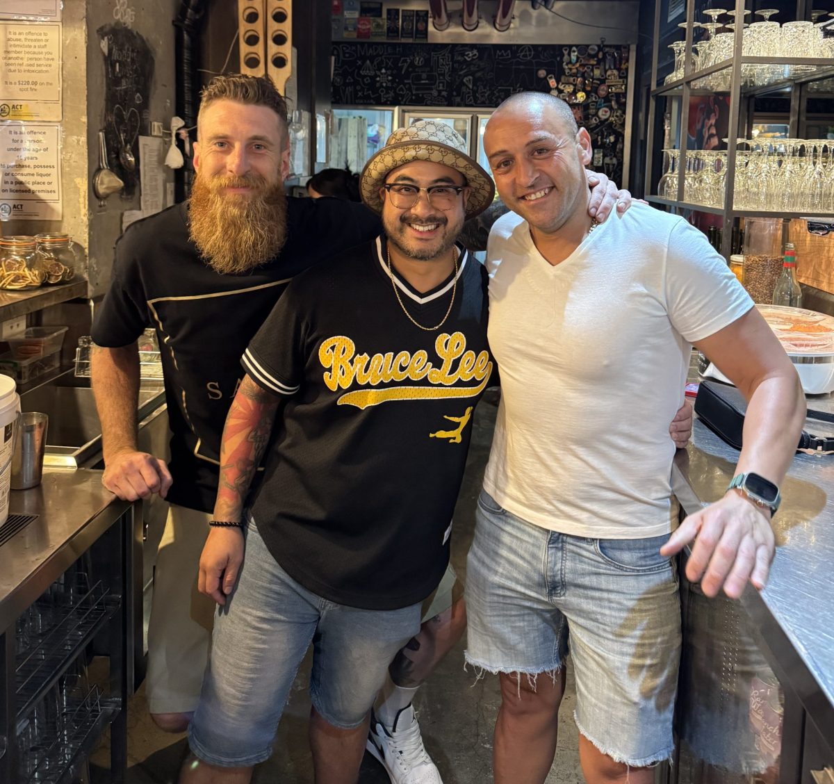 three men in a kitchen