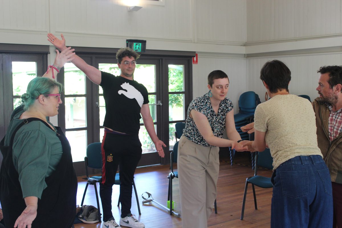 A group of actors in a rehersal