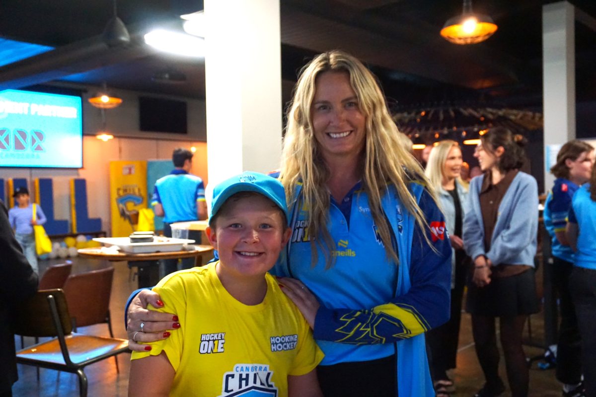 woman with a young hockey fan