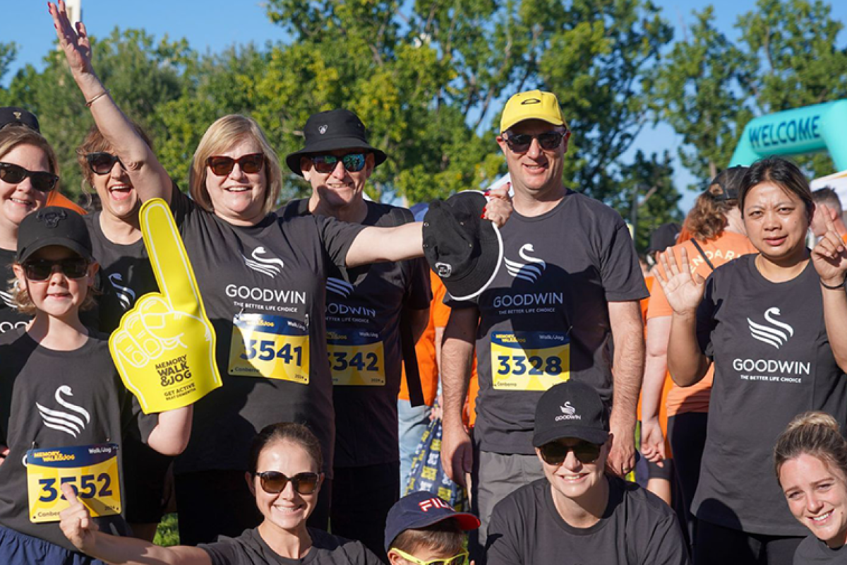 a group of people wearing active gear participating at a fundraising walk and jog