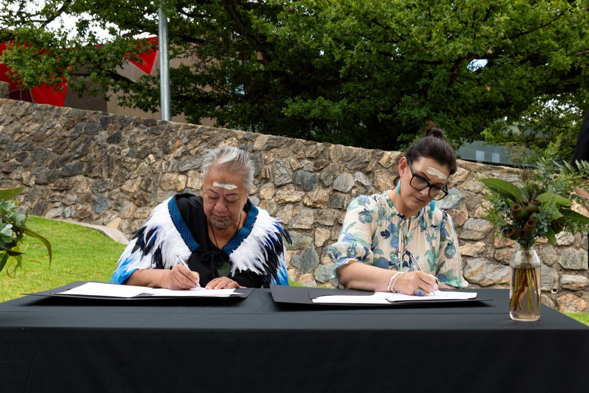 Oldest living Moriori Flora Mitchell and trustee Belinda Williamson sign documents