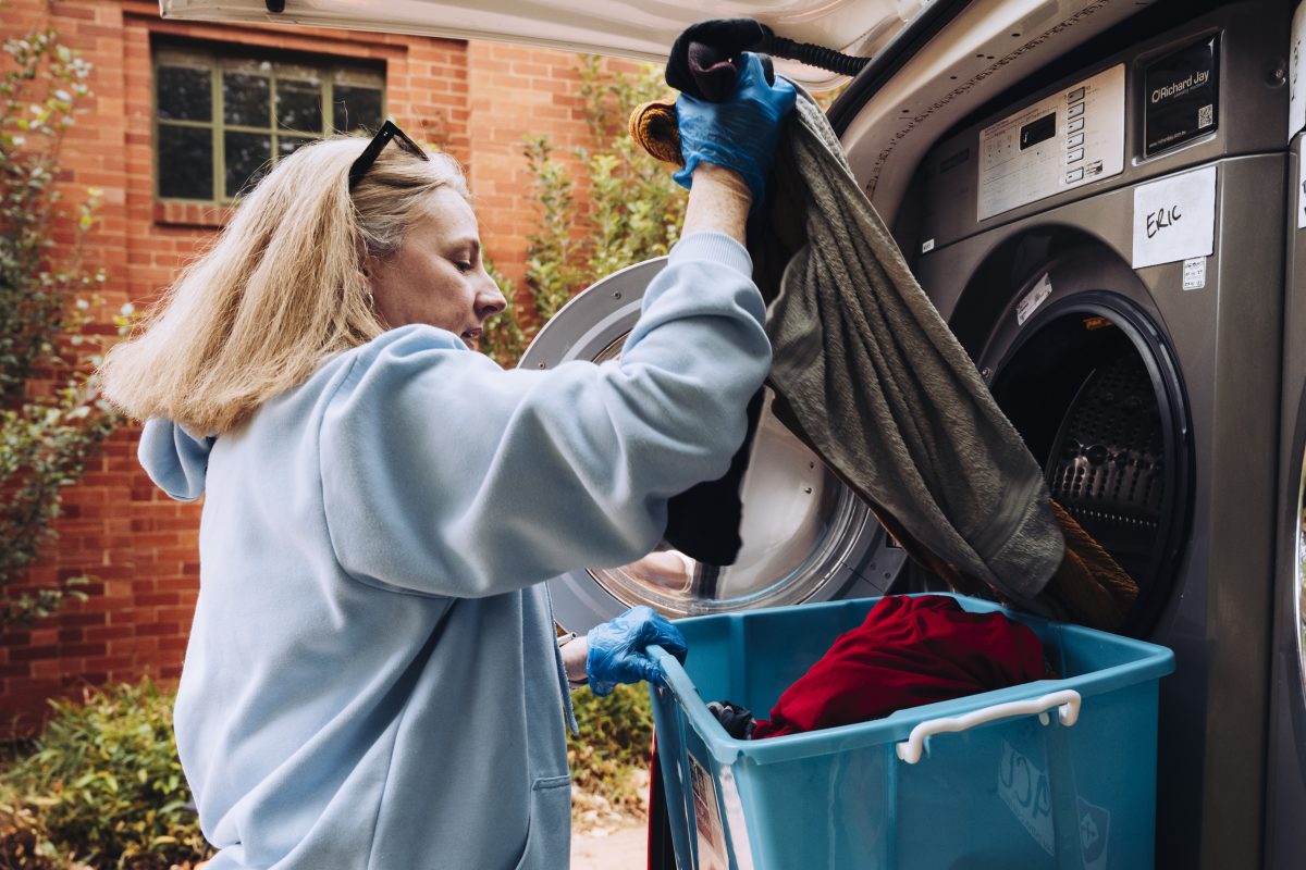 woman loading laundry van