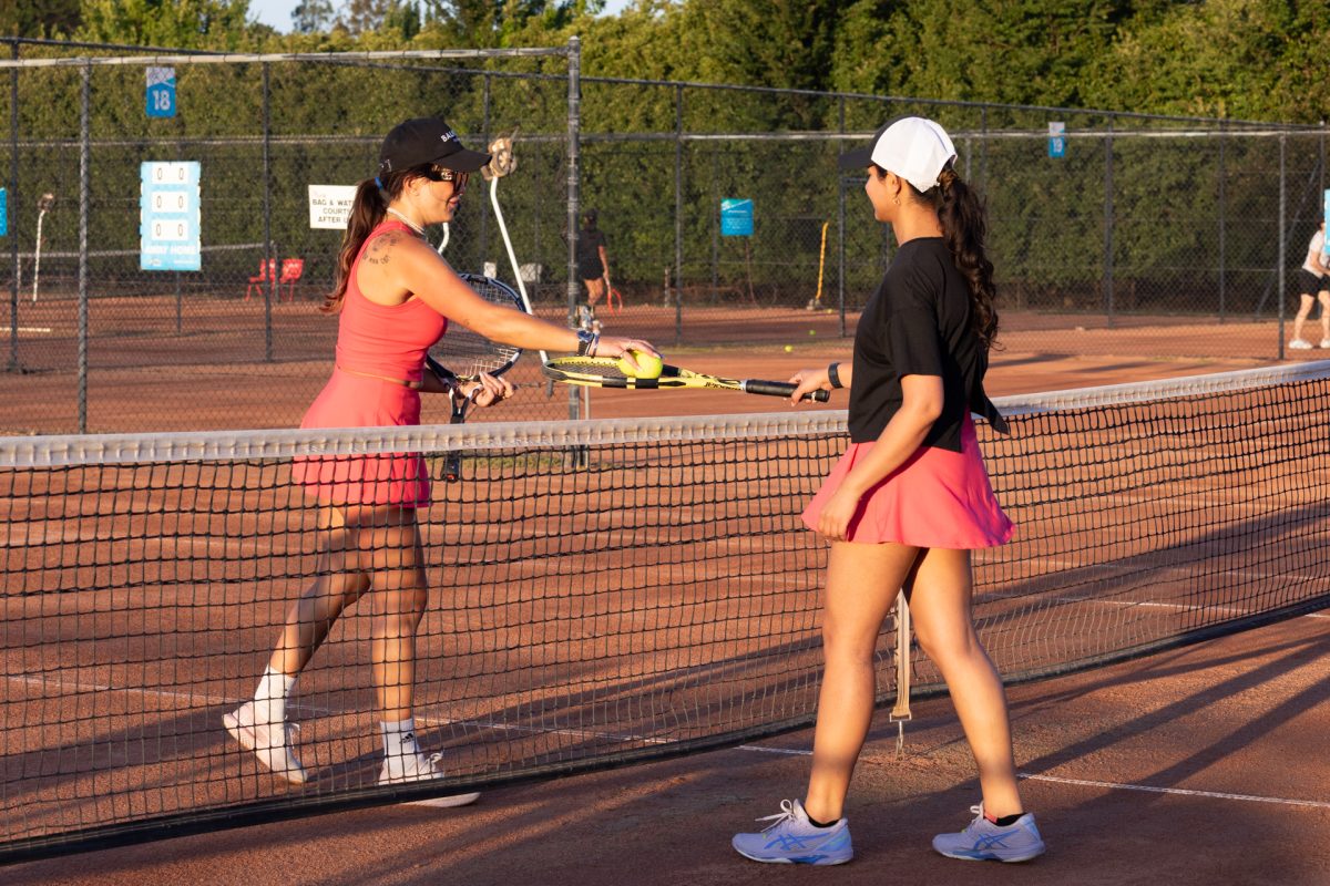 Women play tennis