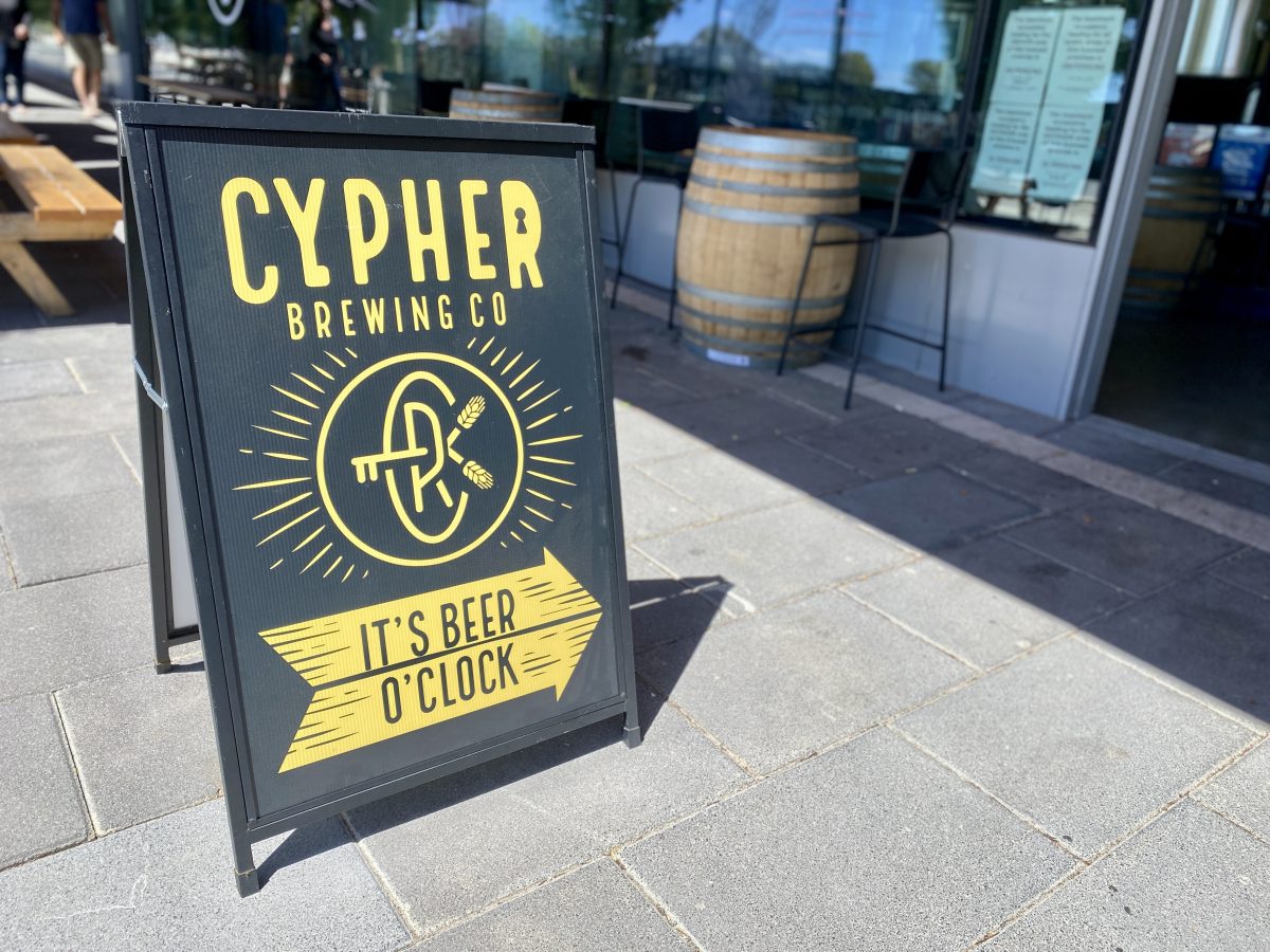 An A-frame reads "Cypher Brewing co, it's beer o'clock"