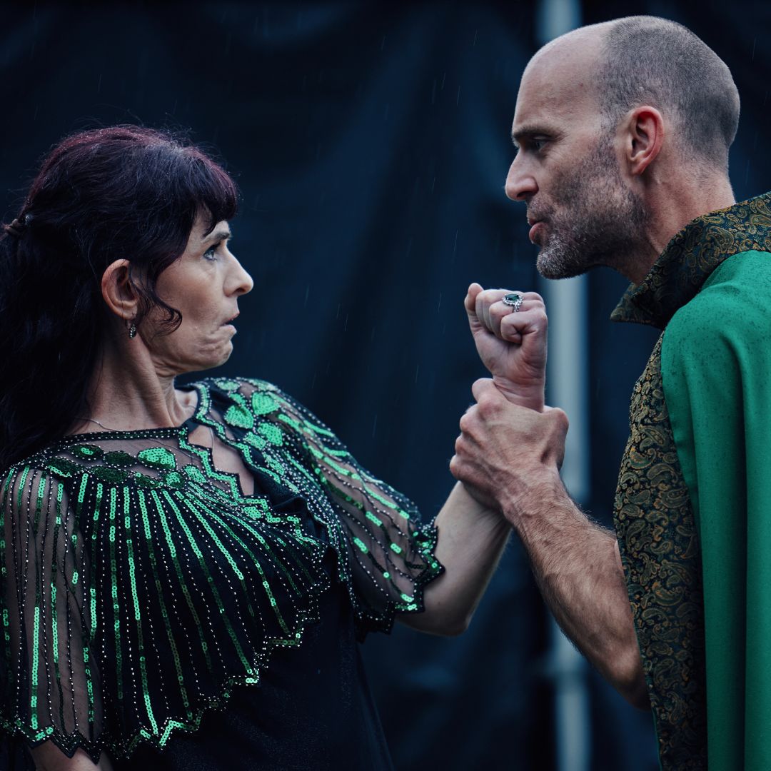 actors grappling on stage