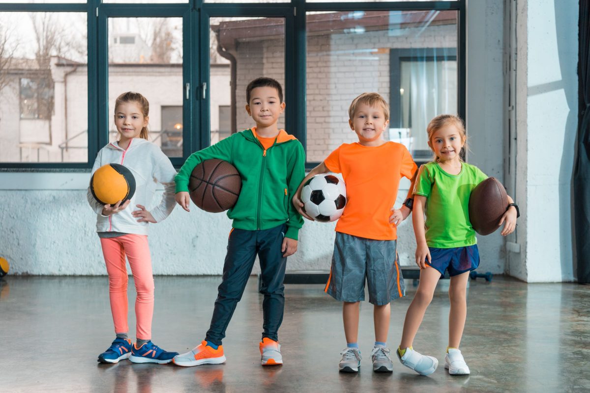 Kids holding balls