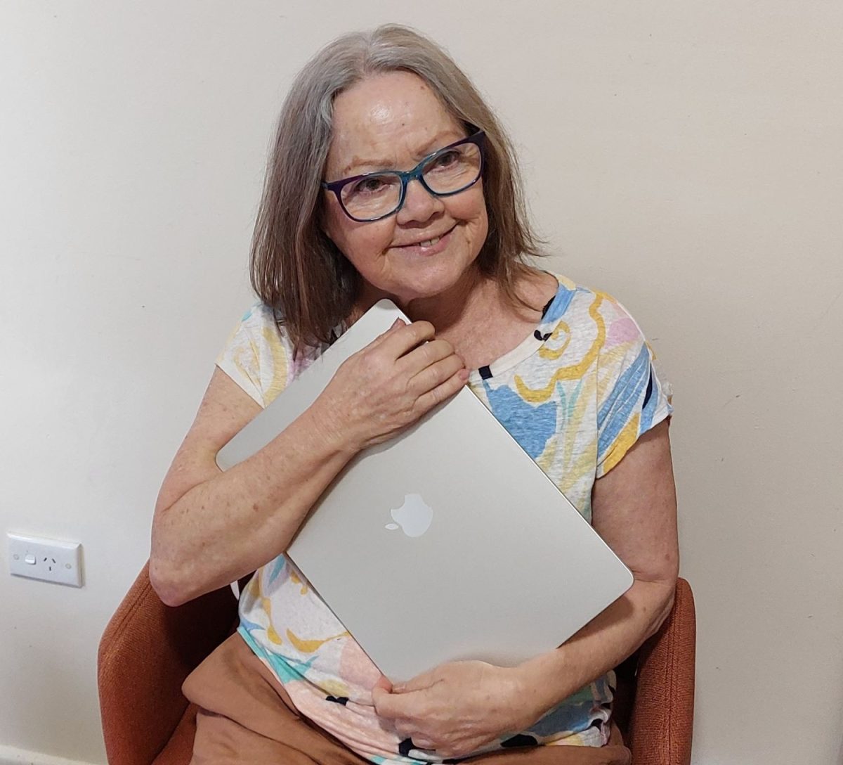 Woman holding a computer