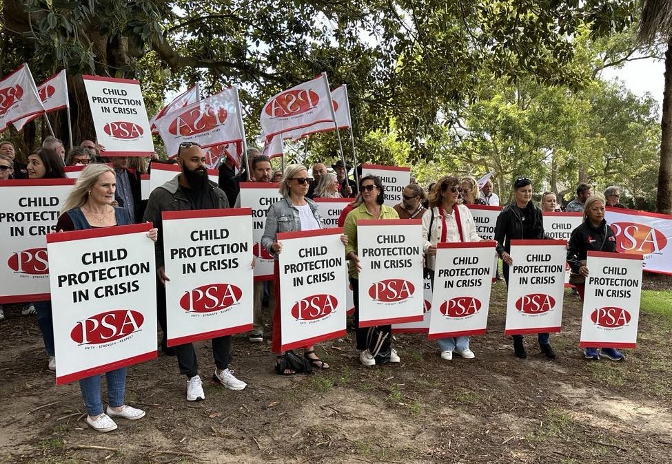 Child Services workers protest out the back of NSW Parliament.