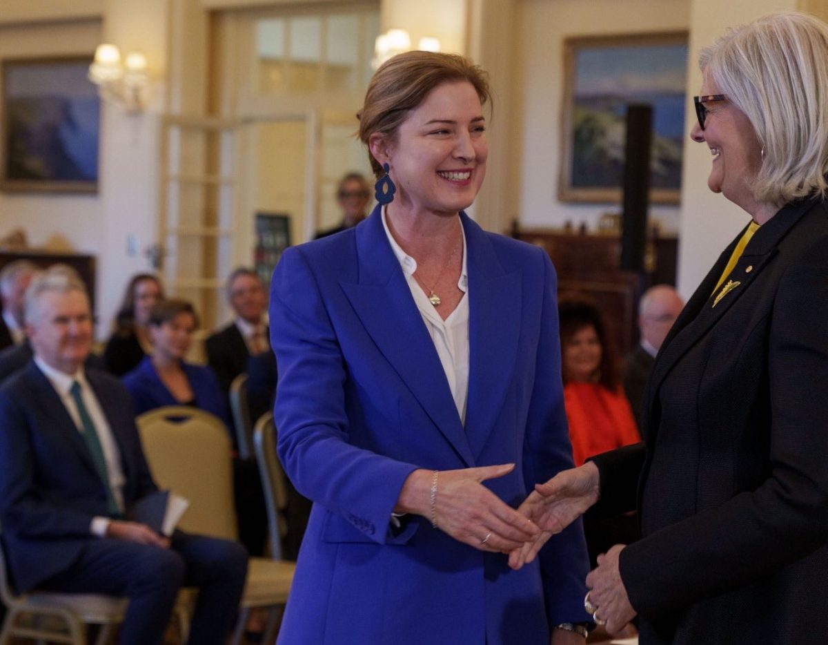 two women shaking hands