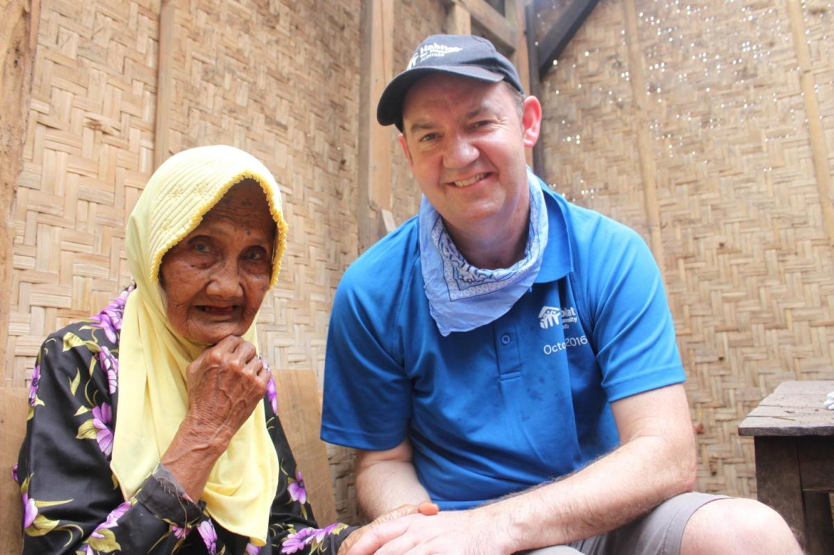 man with elderly woman in a shelter