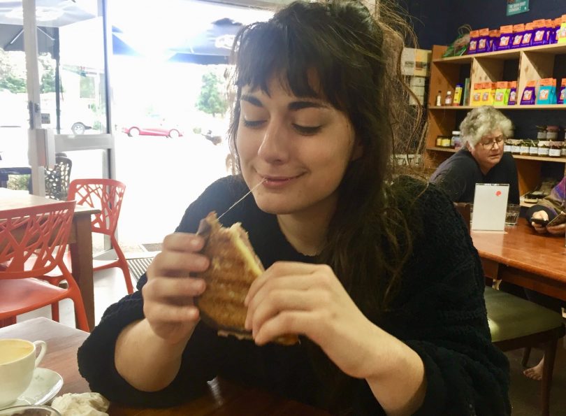 French woman Aurele Roy tastes the Croque Monsieur from Blend at Tathra. Photo: Lisa Herbert