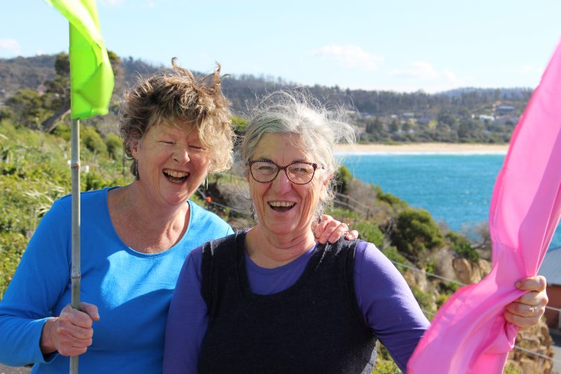 Pip Marshmen and Chris Hamilton, being blown away at Tathra Headland. Photo: Ian Campbell.