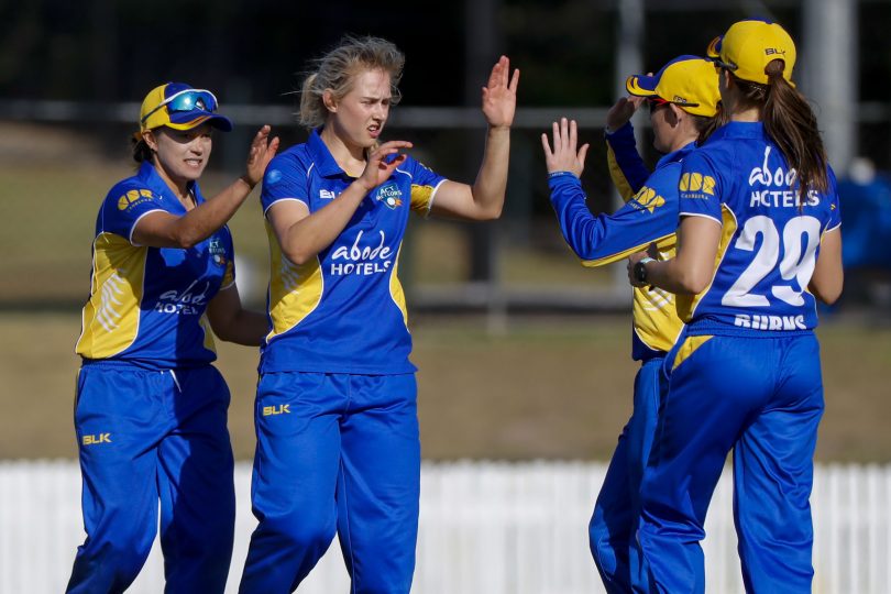 Maitlan Brown(2nd from left) of ACT celebrates with team mates after getting the wicket of Corinne Hall of Tasmania during the Women's National Cricket League (WNCL) One-Day match between Tasmania and the ACT at Allan Border Field in Brisbane, Friday, September 21, 2018. (AAP Image/Glenn Hunt) 