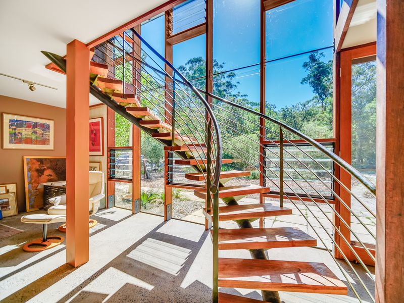 A solid circular staircase connects the two levels of the main house. Photo: Supplied. 