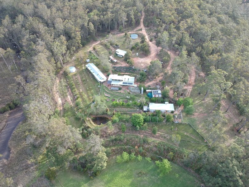 Seen from above, The Crossing's permaculture gardens sprawl over the cleared north-facing slope. Photo: Supplied. 