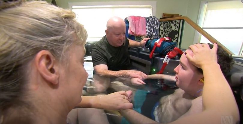 Kieran Reynolds at home with his parents Suzanne and Mick. Photo: ABC, Four Corners.