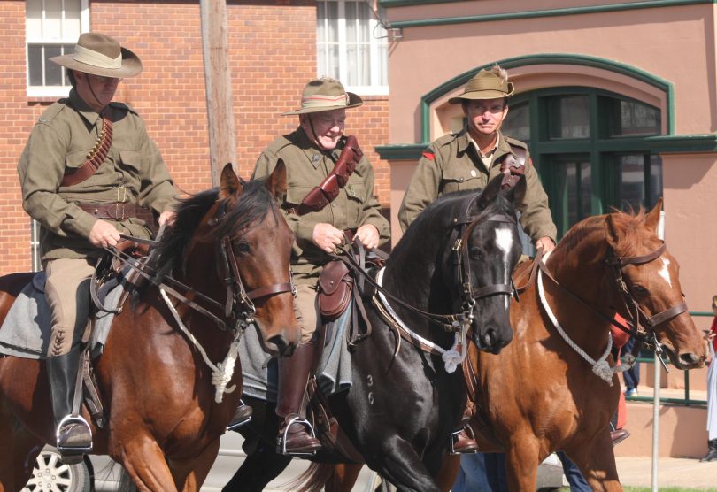 Neale Lavis, centre, leads the Braidwood Anzac Day March in 2015