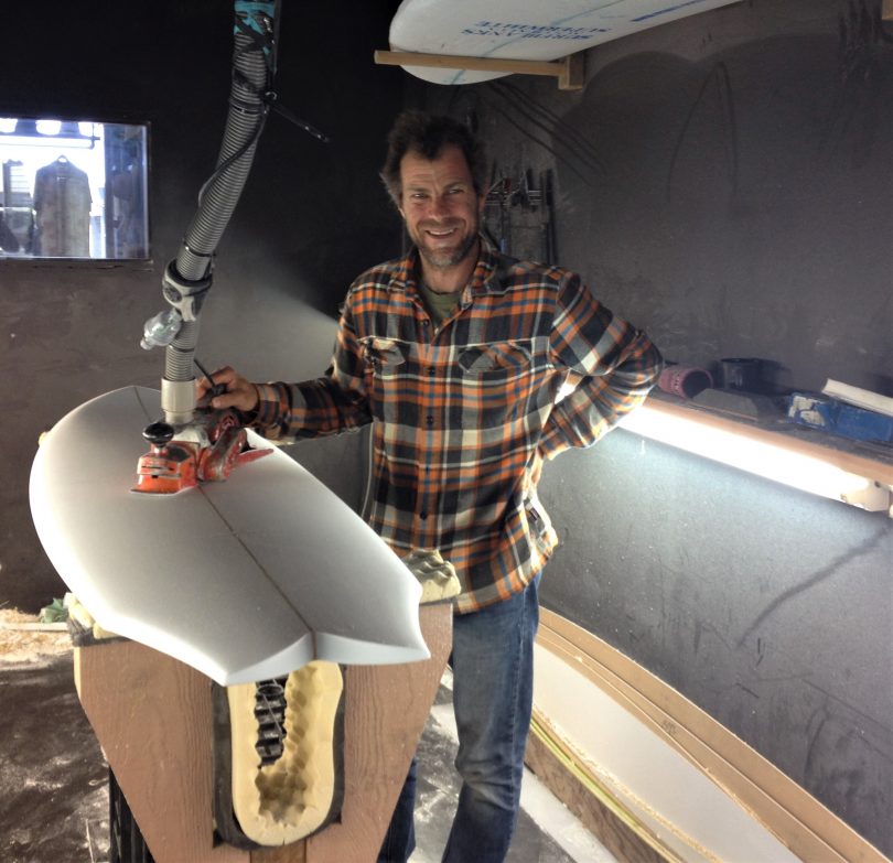 Jed in the small workshop at the back of Switchfoot Boardstore. He also has a big workshop at his Bournda home. Photo: Elka Wood. 