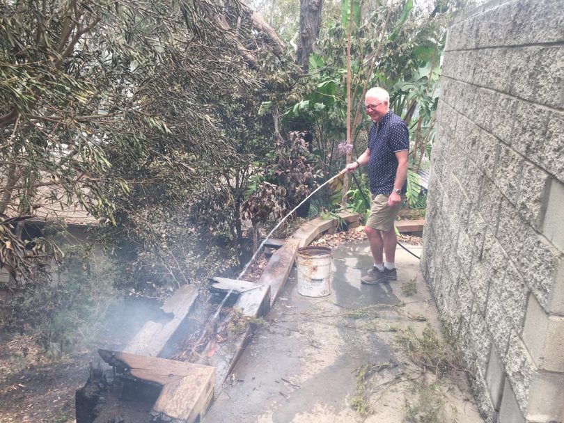 The verandah under his neighbour's house is still burning. 