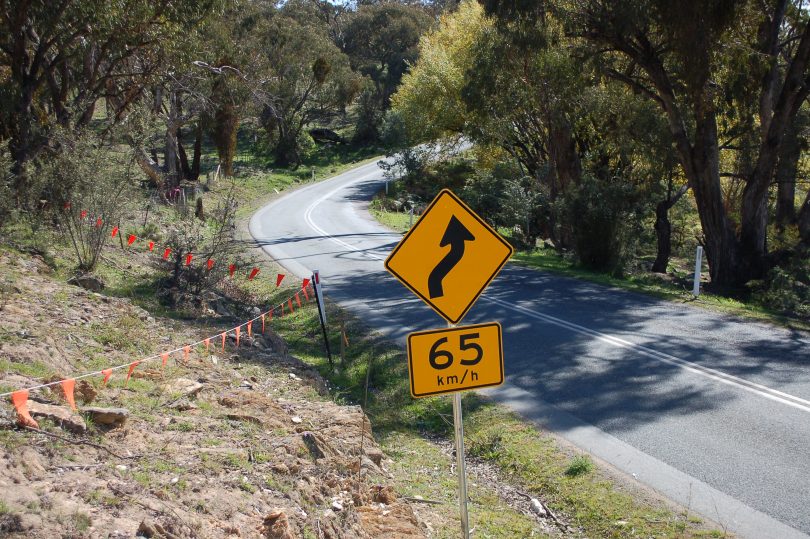 Street sign and winding road at Burra.