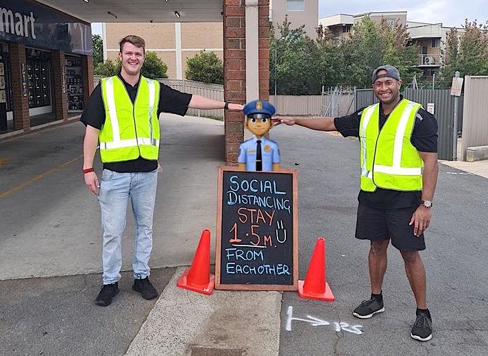 Hotel Queanbeyan staff members display social distancing measures.