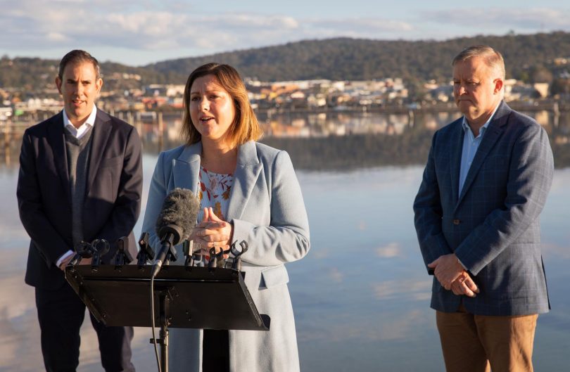 Kristy McBain addressing the media with Anthony Albanese behind her.