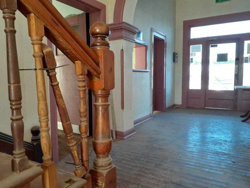 The downstairs lobby, with broken banister, of Hotel Australasia.