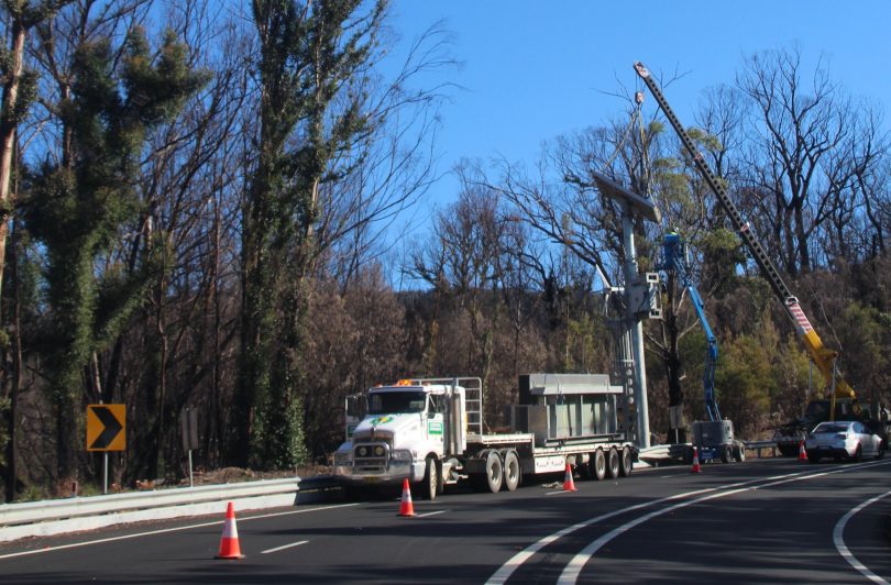 Crane dismantling electronic messaging sign on Kings Highway at Clyde Mountain.