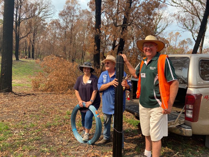 Kevin Butler on rural property with BlazeAid volunteers.