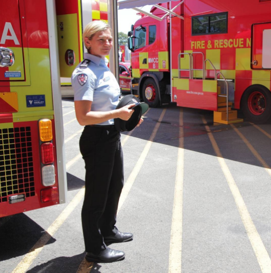 Bronnie Mackintosh standing next to fire truck.