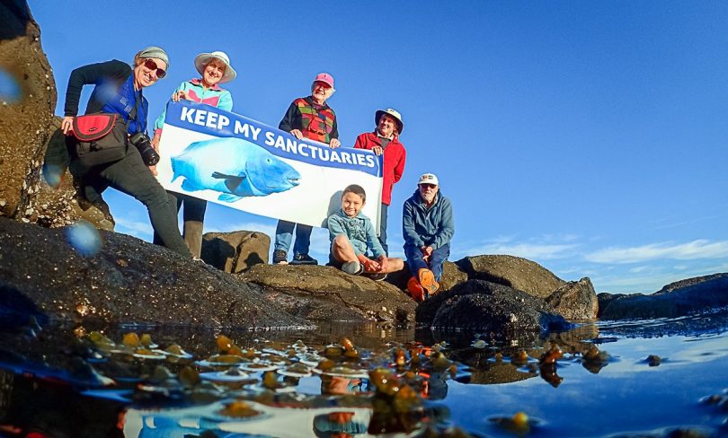 Members of Save Batemans Sanctuaries holding sign.