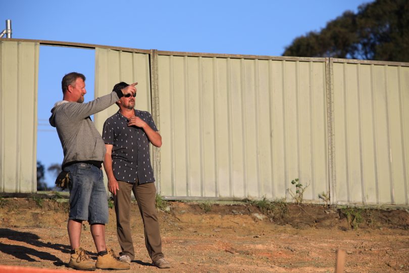 Jim Hughes and a neighbour on Jim's property at Catalina.