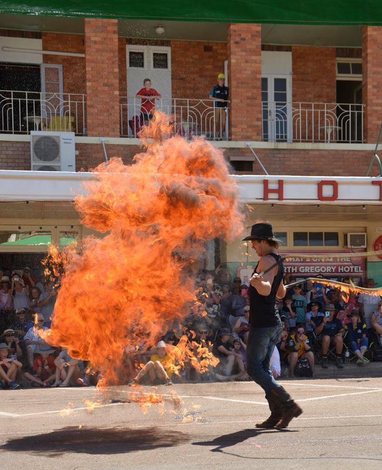 Nathan 'Whippy' Griggs performing whip cracking with fire.