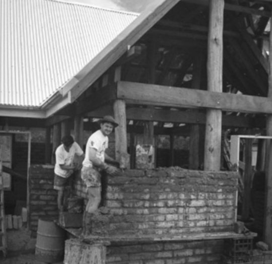 Richard Glover and Philip Clark building house with mud bricks.