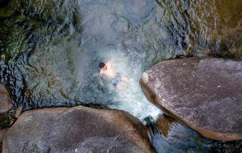 A man swimming in a river