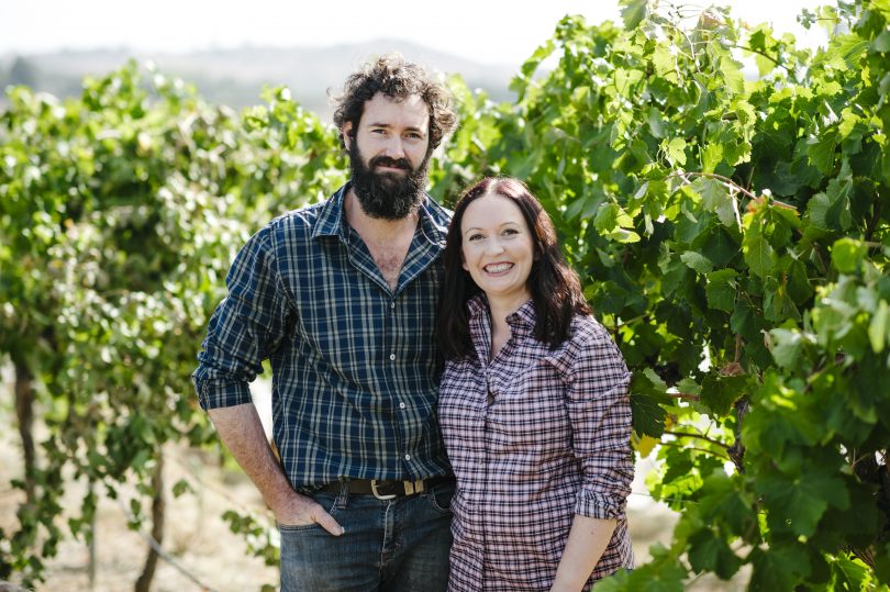 Stephanie Helm and Ben Osborne standing in their vineyard