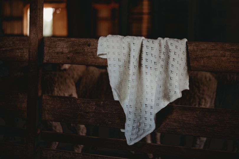 Sarah Jane Bond blanket hanging on stable fence